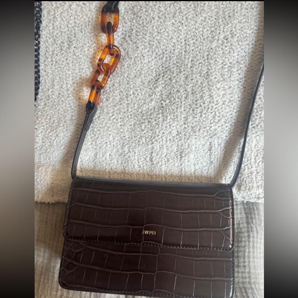 JWPEI crossbody brown bag with acrylic tortoise ring details